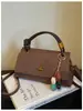 Bolsa feminina texturizada de alta qualidade 2026 nova moda bolsa transversal versátil bolsa de mão pequena requintada para sair