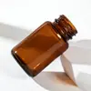 Botellas marrones selladas de boca ancha hechas a medida del fabricante, botellas dispensadoras de vidrio universales a prueba de luz para productos de salud, laboratorios y cosméticos