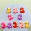 Nuevos accesorios de resina de dinosaurio pequeño de dibujos animados, funda para teléfono, llavero colgante, material para joyería DIY al por mayor