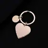 Llavero de acero inoxidable grabado para regalo de vacaciones, material en blanco transfronterizo, llavero metálico redondo pequeño con forma de corazón cóncavo