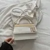 Bolso de mano nuevo de 2026 con bloques de color y patchwork, con un elegante cierre metálico, diseño de bolso de hombro y un bolso cruzado versátil de estilo coreano