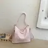 Bolsa tote estilosa e espaçosa para o dia a dia, nova coleção primavera 2026 feminina, bolsa de ombro simples e casual, design de alta qualidade e mochila versátil
