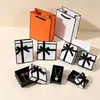 Caja de Joyería Estilo Chanel con Tapa y Base Negra con Borde Naranja para Anillos, Joyería, Pulseras, Collares y Embalaje de Accesorios