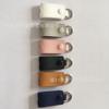 Funda protectora de cuero para cable de datos caliente transfronterizo, llavero de cuero genuino para almacenamiento de cable de auriculares, logotipo personalizable