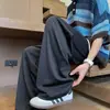 Calça Casual de Seda Gelada com Caimento Fresco para o Verão 2025 Masculina Estilo Japonês Solta Calça Cimitarra Feminina Estilo Hong Kong Calça Reta de Perna Larga