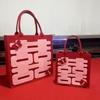 Nova bolsa de feltro presente de casamento bolsa grande feltro caractere Xi bolsa de mão de feltro doces de casamento sementes de melão bolsa de armazenamento