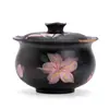 Cerámica negra, tinta plana, diseño de lirio, pintura al agua pura, tapa ribeteada en oro, cuenco de té de gran capacidad, cuenco con infusor de té, juego de té de cerámica, cuenco de té