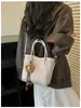 Bolso Único de Textura Tejida de Nicho 2026 Nuevo Otoño/Invierno Retro Versátil Bolso Cruzado Bolso de Mano Tipo Cubo para Mujer