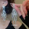 Aretes de Aguja Plateada con Borlas Redondas Huecas Incrustadas de Diamantes, Estilo Europeo y Americano, Diseño Minimalista, Lujo Ligero, Aretes de Alta Gama