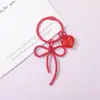 Llavero Colgante de Aleación de Zinc Pintado en Spray con Forma de Lazo, Cinta Larga Hueca y Colgante de Corazón, Accesorio DIY para Decoración de Bolsos