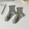 Primavera y verano nuevos calcetines cortos todo en uno de madera de color sólido con orejas de tacón de talla grande para mujer miu girl calcetines de encaje