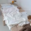 Algodón clase A apto para la piel Conjunto de dos piezas de verano para niños, top de manga corta y shorts, estampado de dibujos animados para bebé, ropa de casa transpirable