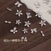 Joias de unha novas zircônia flash acabamento flor borboleta tridimensional cinco pétalas prata usando acessórios de unha atacado