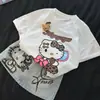 Camiseta Infantil de Verão com Estampa de Desenho 2025 Novo Estilo Roupa de Bebê Menina Saia Jeans Estampada Fofa Conjunto de Duas Peças