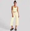 Conjunto de fitness transfronterizo con top de tirantes anchos para yoga, conjunto de pantalones capri de running para fitness que absorben la humedad y se secan rápidamente