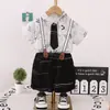 Traje de Verano para Niños de Manga Corta Nueva Llegada Moda de Verano Atractivo Celebridad Cibernética Calle Frita Pantalones Cortos con Correa de Lazo en Relieve traje