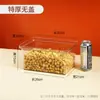 Estante de supermercado alimentos latas selladas caja de almacenamiento plástico transparente exhibición botanas azúcar fruta seca semillas de melón fritas