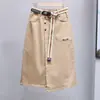 Talla grande verano irregular A- línea falda adelgazante moda cintura elástica falda de mezclilla combinable falda midi moderna para mujer