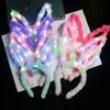 Venta al por mayor transfronteriza de juguetes para niños puesto de mercado nocturno juguetes luminosos网红 de Internet 14 luces orejas de conejo diadema luminosa de peluche