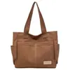 Bolsa de Lona Estética de Alto Valor para Mulheres, Grande Capacidade, Bolsa de Ombro para Estudantes, Bolsa de Mão Portátil, Novo Estilo Tendência Primavera/Verão 2026