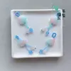 Precio mayorista directo de fábrica pulsera hecha a mano pulsera con colgante diy accesorios pequeños deslizantes colgante de garra de gato lindo Joker