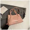 Bolso pequeño retro de moda transfronteriza para mujer, bandolera cruzada sencilla y portátil, de primavera 2025.