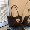 Bolso tote de hombro único de alta gama transfronterizo para mujer, nuevo patrón tejido de moda, gran capacidad, para ir al trabajo, bolso tipo cesta para debajo del brazo