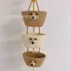 Cesta colgante de tres capas del fabricante Cesta de cuerda de algodón para Año Nuevo Decoración Cesta de almacenamiento de cosméticos de tres Ouli de dibujos animados Cesta para el hogar montada en la pared