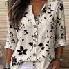 Camisa de cuello en V estampada en azul y blanco, de manga tres cuartos, top vintage para vacaciones, ropa de mujer para comercio exterior al por mayor, 2026