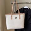 La popular bolsa de mano grande casual retro simple de este año para mujer, para el trabajo y los desplazamientos, bandolera de color liso versátil