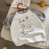 Camiseta de verano para niños de algodón puro de manga corta, diseño moderno estilo coreano con bloques de color, unisex, estampado de dibujos animados, top versátil de media manga para niños mayores