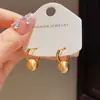 Pendientes redondos de metal cepillado de estilo retro francés, artesanía sencilla, con un diseño único y lujoso para mujer