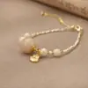 Joyería al por mayor: lapis lázuli natural, pulseras de perlas de lujo ligero de nicho, accesorios versátiles para niñas, joyería simple de alta gama