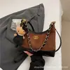 Bolso de mano pequeño de estilo fragancia exquisita con diseño de rejilla cruzada para mujer 2026 nuevo bolso bandolera de cadena de alta gama bolso de hombro único retro