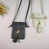 Venta al por mayor de fábrica moda estilo pequeño colgante de borla funda cruzada para teléfono tarjeta monedero multiusos de alta calidad