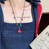 Collar trenzado de corazón colorido de dopamina para mujer 2025 Nuevo lindo colgante largo de cadena para suéter halter Accesorios