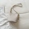 Bolso de mujer moderno y de alta gama 2026 nuevo verano nicho retro bolso cubo para ir al trabajo y uso casual, bolso bandolera versátil