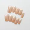 Rosa nude suave tono melocotón rosa pálido brillo suave uñas postizas naturales estilo cat-eye