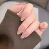 Manicura Color Nude Hecha Completamente a Mano Estilo Corto Usable Estilo Año Nuevo 2025 Gama Alta Exquisita Primavera y Verano Color Puro Blanqueador