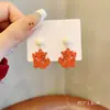 Pendientes festivos de Año Nuevo rojos, pendientes de año de nacimiento de dragón femenino, pendientes de diseño de nicho de alto sentido, pendientes de Año Nuevo de otoño e invierno