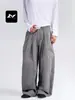 Con un rico toque americano de alta gama, pantalones casuales plisados para hombre y mujer, marca de moda de corte holgado y limpio, silueta con caída, pantalones de pierna curva