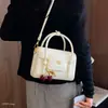 Bolso bandolera versátil bolso de mano de nicho bolso de hombro para mujer de mano nueva textura pequeño cuadrado 2026 sensación pequeña