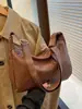 Bolso de axila para mujer modelo nuevo 2026 transfronterizo, bolso de hombro para mujer versátil de moda de alta gama, estilo casual vintage de otoño e invierno
