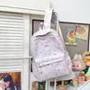 Mochila nueva estilo japonés de alta apariencia estilo universitario para mujer con estampado de estrellas, bolsa ligera de doble hombro para estudiantes de secundaria y preparatoria