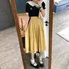 Falda Plisada de Otoño 2026 de Longitud Media Nuevo Estilo Francés de Cintura Alta Adelgazante Chic que Cubre la Cadera para Mujer