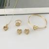 Europa y los Estados Unidos transfronterizos moda temperamento hueco amor lleno de diamantes pendientes collar anillo tres piezas simple elegante traje