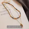 Cadena de Suéter Apilada de Doble Capa de Piedra Ojo de Tigre para Mujer Retro Nueva Popular Otoño e Invierno Collar Joyería de Nicho de Alta Gama