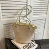 Bolso de mano tejido transfronterizo, bolso de mano ligero de lujo para la playa y el mar, bolso de hombro individual de paja de gran capacidad con pliegues y letras de moda