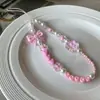 Cadena de Mano con Colgante de Lazo de Corazón Rosa Girly Correa para Teléfono Pulsera Diseño Pequeño de Nicho Universal