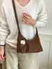Bolso de mano informal transfronterizo, bolso de hombro, bolso cruzado, nuevo estilo vintage otoño 2026, gran capacidad, elegante, para el trabajo, tipo bolsa de albóndiga